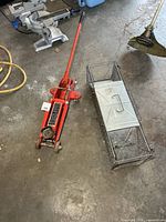 Trolley jack and live trap on floor