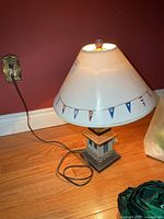 Full lamp plugged in showing shade and base