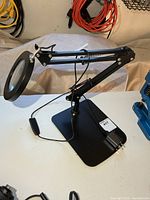 Full view of magnifier desk lamp on base