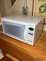 Front view showing entire microwave, door, and control panel