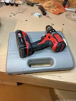 Drill resting on closed grey bit case