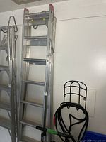 Aluminum multi-position ladder folded; view of rungs and hinge points