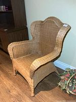 Front angled view of wicker armchair showing overall form