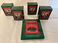 Five original Hallmark boxes including four ornament boxes and one stand box