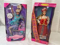 Front view of both boxed dolls