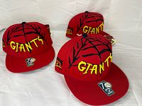 Three identical red SF Giants Spider-Man themed hats with tags