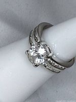 Front view of sterling silver ring displaying oval center stone and split shank