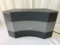 Front view of Bose Acoustic Wave Music System II showing curved design and speaker grilles