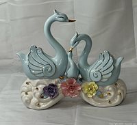 Full view of ceramic swan family figurine