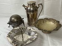 All four silver-plated pieces grouped