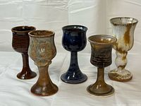 Front view of all five handmade stoneware goblets