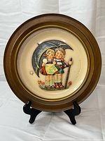 Front view of plate in display frame with easel