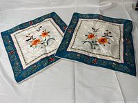Both cushion covers showing full design and borders