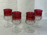 Four ruby flash thumbprint goblets, frontal view