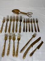 All flatware pieces laid out, showing counts and types