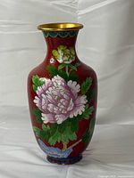 Front view of red cloisonné vase showing large pink peony