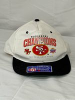 Front view of cap showing graphics and brim