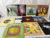 All 11 album covers laid out on white backdrop