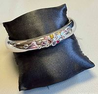 Bangle on cushion showing gemstone cluster