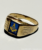 Perspective view showing ring design and emblem