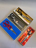 Overview of three boxed vintage shears
