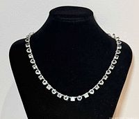 Necklace displayed on bust showing full length and rhinestone pattern