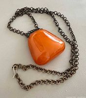 Front view showing pendant and full chain