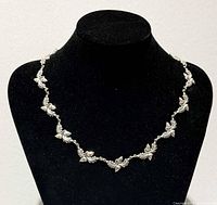 Necklace displayed on bust showing full drape