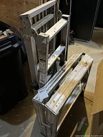 Ladder folded into two-step platform, showing overall structure and wear