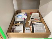 Tray showing large quantity of assorted guitar string envelopes