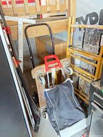 overall group showing sack trolley, wooden dolly, level, scaffold section