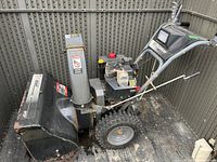 Full view of Murray Select snowblower showing controls, wheels and chute