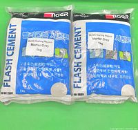Front view of both 1 kg Tiger Flash Cement bags