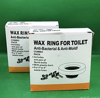 Front view of both boxed wax ring toilet seal combo packs