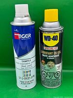 Front view showing both aerosol cans: WD-40 Specialist Gel Lubricant and Tiger Anti-corrosion Primer