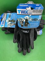 Front of packaged gloves showing brand, model, latex coating