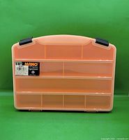 Front view showing translucent lid, internal compartments and Mano 10" label