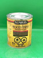 Front view of sealed 946 mL can showing brand, product line, color Dark Walnut, hazard icons