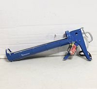 Full view of blue 13" ToolTech caulking gun