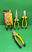 Four pliers showing overall lot