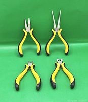 All four pliers arranged; shows full lot