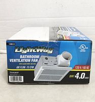 Front of sealed box showing model, specs and image of fan