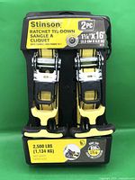 Front view of packaged Stinson ratchet tie-downs showing brand, size, capacity and piece count.