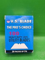 Front of blue box showing brand, quantity, thickness, model