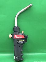 Full view of Tooltech torch head showing curved burner tube and grip