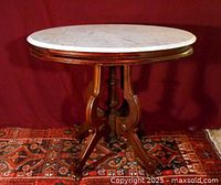 Three-quarter view of entire table against rug backdrop