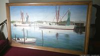 Full view of framed painting showing boats and signature area