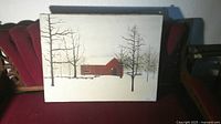Front view of entire unframed painting on canvas showing red barn and trees