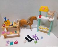 Full lot overview with tiki bar, horse, picnic table and accessories