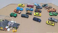 Overall view of vehicles and accessories on cardboard surface